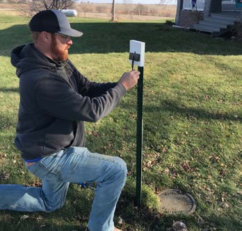 RRWA employee installs smart meter antenna
